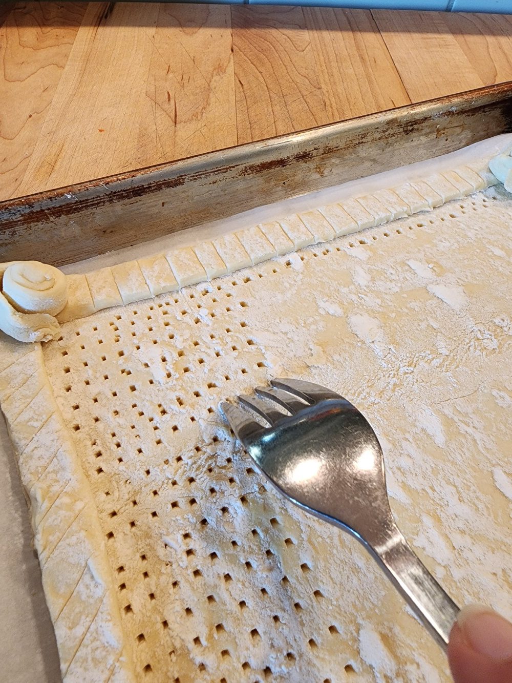 pastry shell scored and pricked