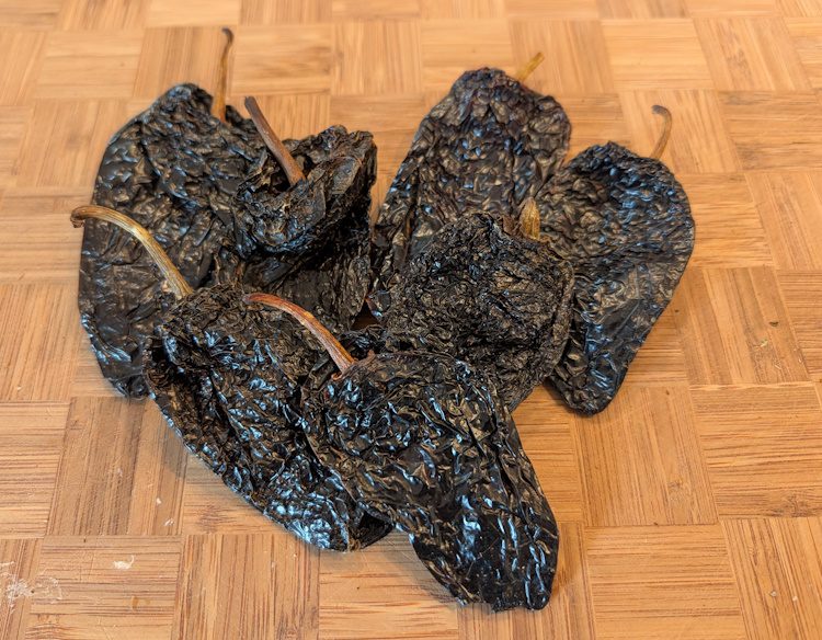 ancho peppers (dried poblano peppers) on a cutting board