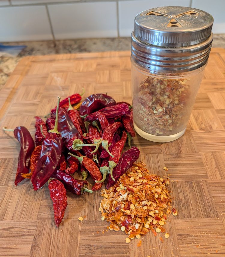 dried chili peppers, seeds, and pepper flakes